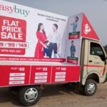 BTL Activities - A Tata Ace vehicle wrapped in brand advertisements moving through a city street