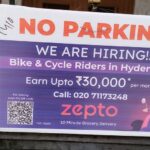 A no parking board featuring a bold call-to-action and brand contact details for customer engagement