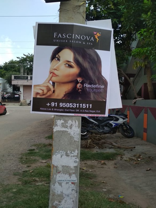 Pole board advertising on a busy street in Hyderabad, ensuring high brand visibility.