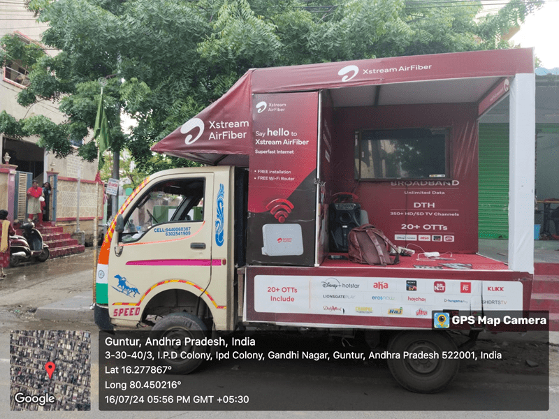 A fully branded Canter Van / Promo Van promoting a retail brand, parked in a high-traffic market area