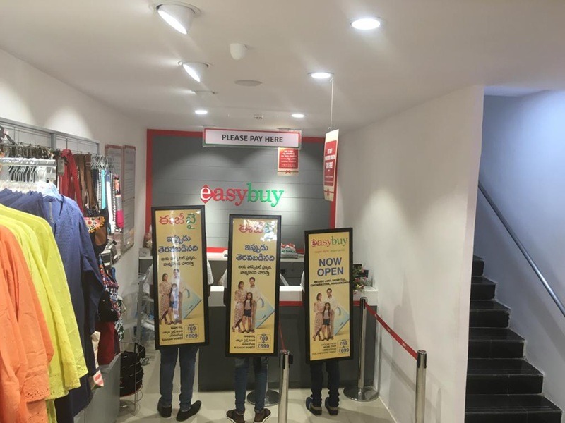 Look Walker advertising with illuminated boards in a crowded marketplace