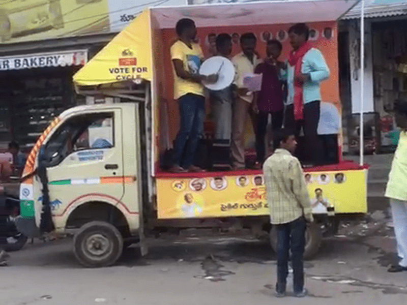 Street play actors dressed in branded costumes, interacting with an audience in a shopping mall