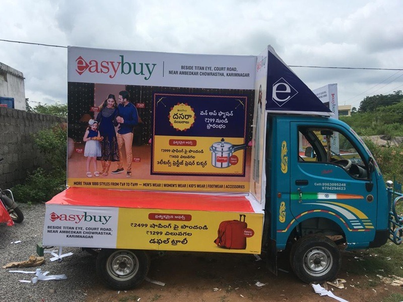 Tata Ace mini truck with partial branding, showcasing a company's logo and promotional message