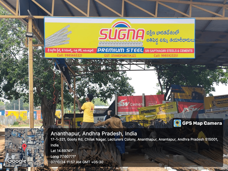 Strategically placed co-branding flex boards at a petrol station with high visibility.