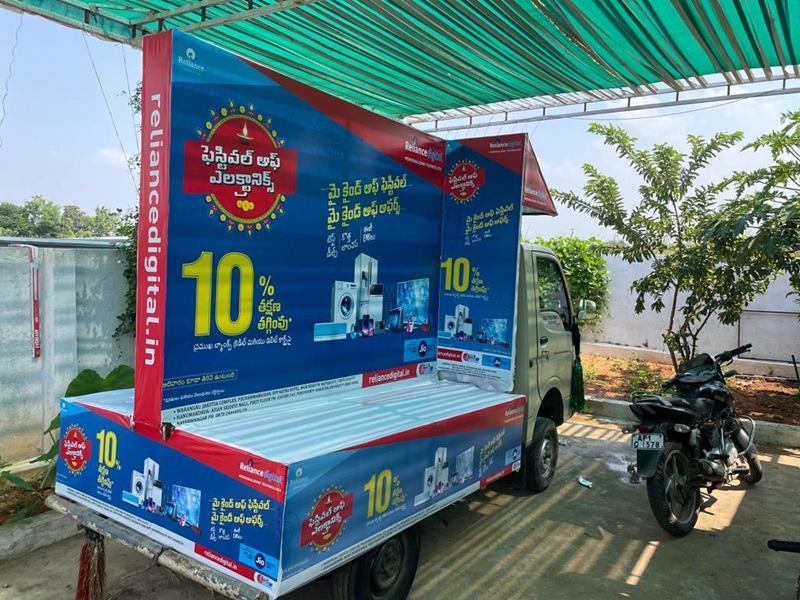 Tata Ace vehicle with mobile advertising moving along a busy highway, reaching thousands of daily commuters