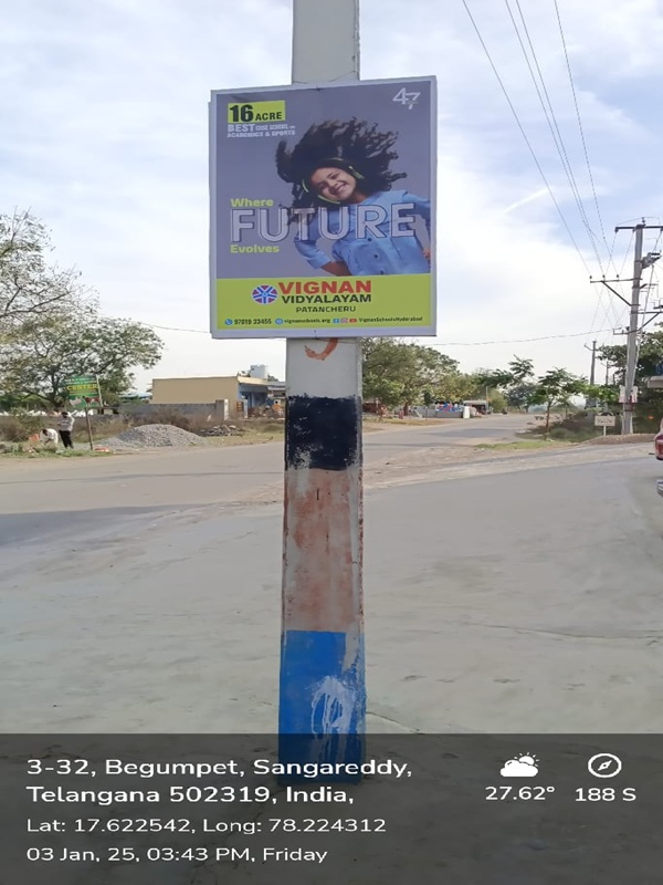 Pole board ads near a hospital promoting healthcare services in Andhra Pradesh