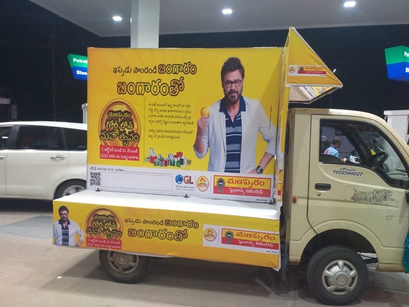 A Tata Ace vehicle displaying brand advertising at a public event, attracting foot traffic and customer engagement