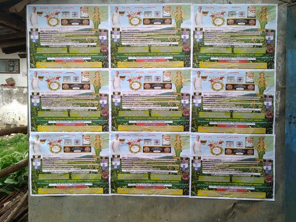 Wall posters advertising in a busy Hyderabad market