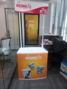 Branded Demo Table at a Trade Fair Showcasing Consumer Electronics