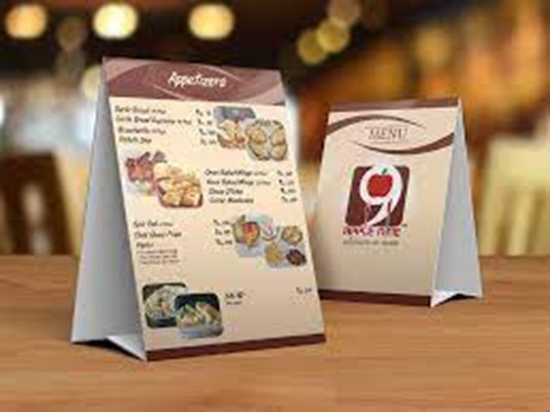 QR code tent cards for digital menu access at a café.