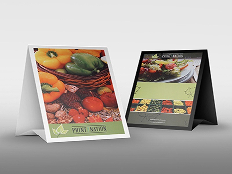 Acrylic tent card with engraved branding for hotel tables.
