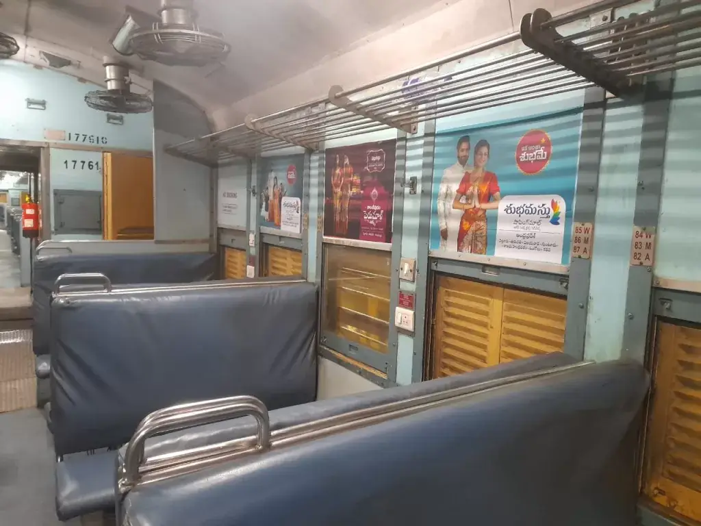 Train Interior Advertising - Branded side panels inside a train coach featuring colorful advertisements