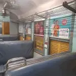Train Interior Advertising - Branded side panels inside a train coach featuring colorful advertisements