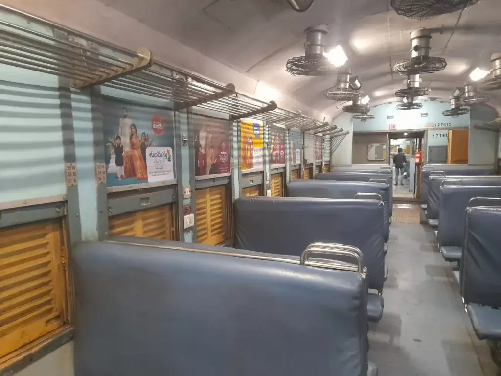 Train Interior Advertising - Branded side panels inside a train coach featuring colorful advertisements