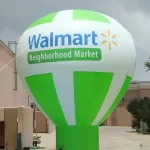 Inflatable Advertising Balloon - Floating helium balloon with custom brand logo and tagline.