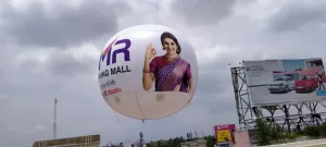 Inflatable Advertising Balloon - Floating helium balloon with custom brand logo and tagline.