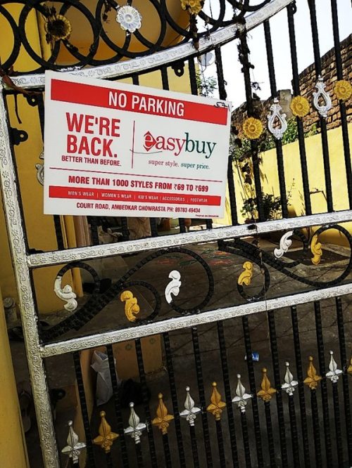 No parking boards placed at the entrance of an apartment complex for continuous brand exposure.