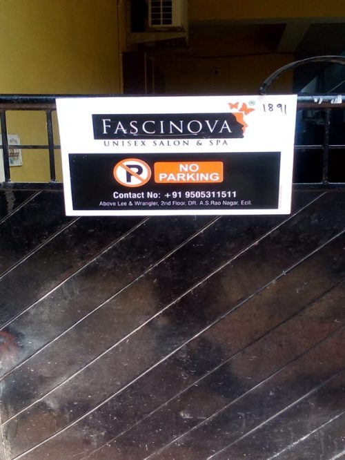 A branded no parking board installed outside a retail store, ensuring brand visibility to customers and passersby.